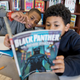 In Washington, D.C., fifth-graders Kemari Starks and Daymon Dimson discuss the Black Panther story as part of an increasingly popular all-boys book club at the Truesdell Education Campus. (Tyrone Turner/WAMU-FM)